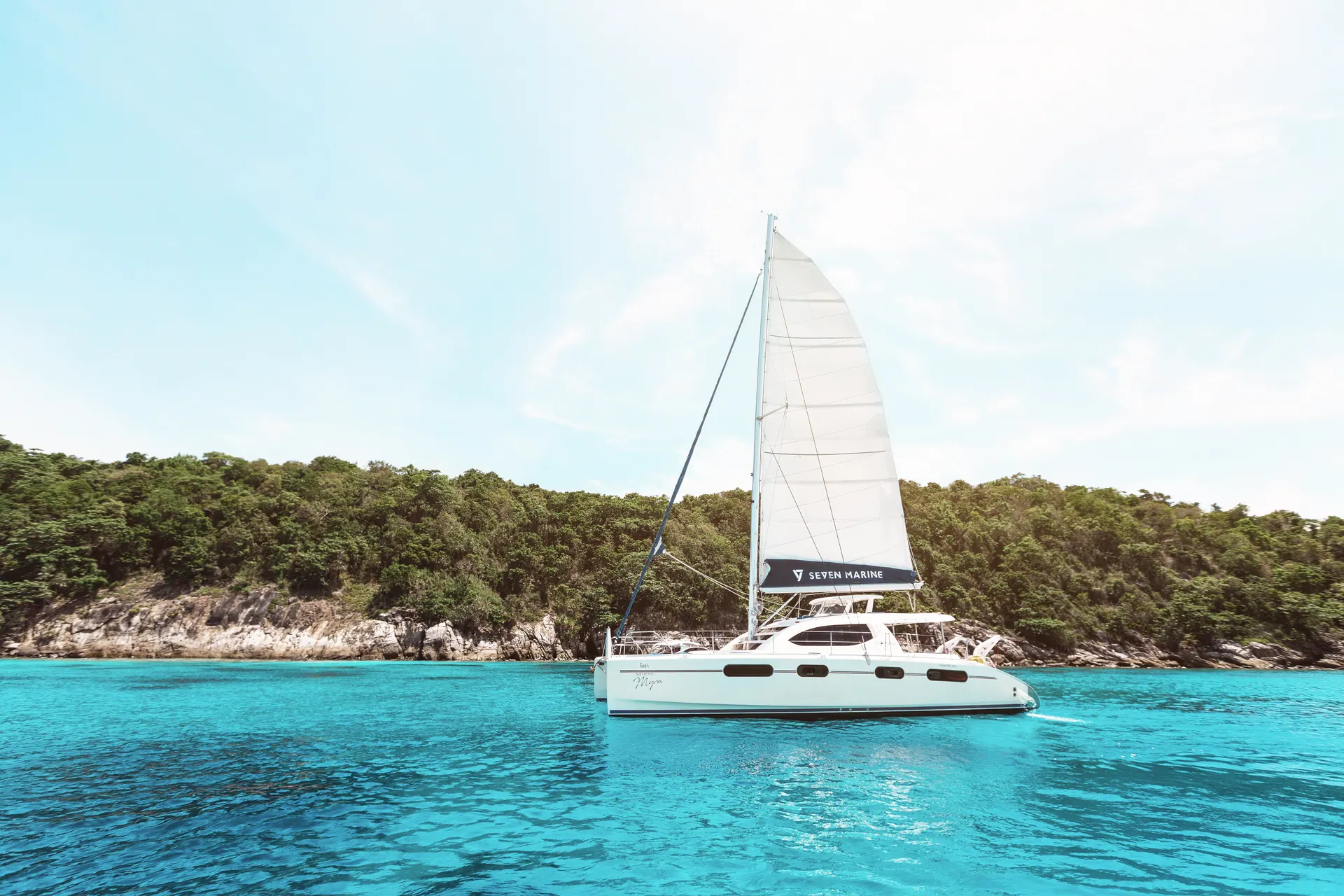 MYRA sailing beside a tropical island
